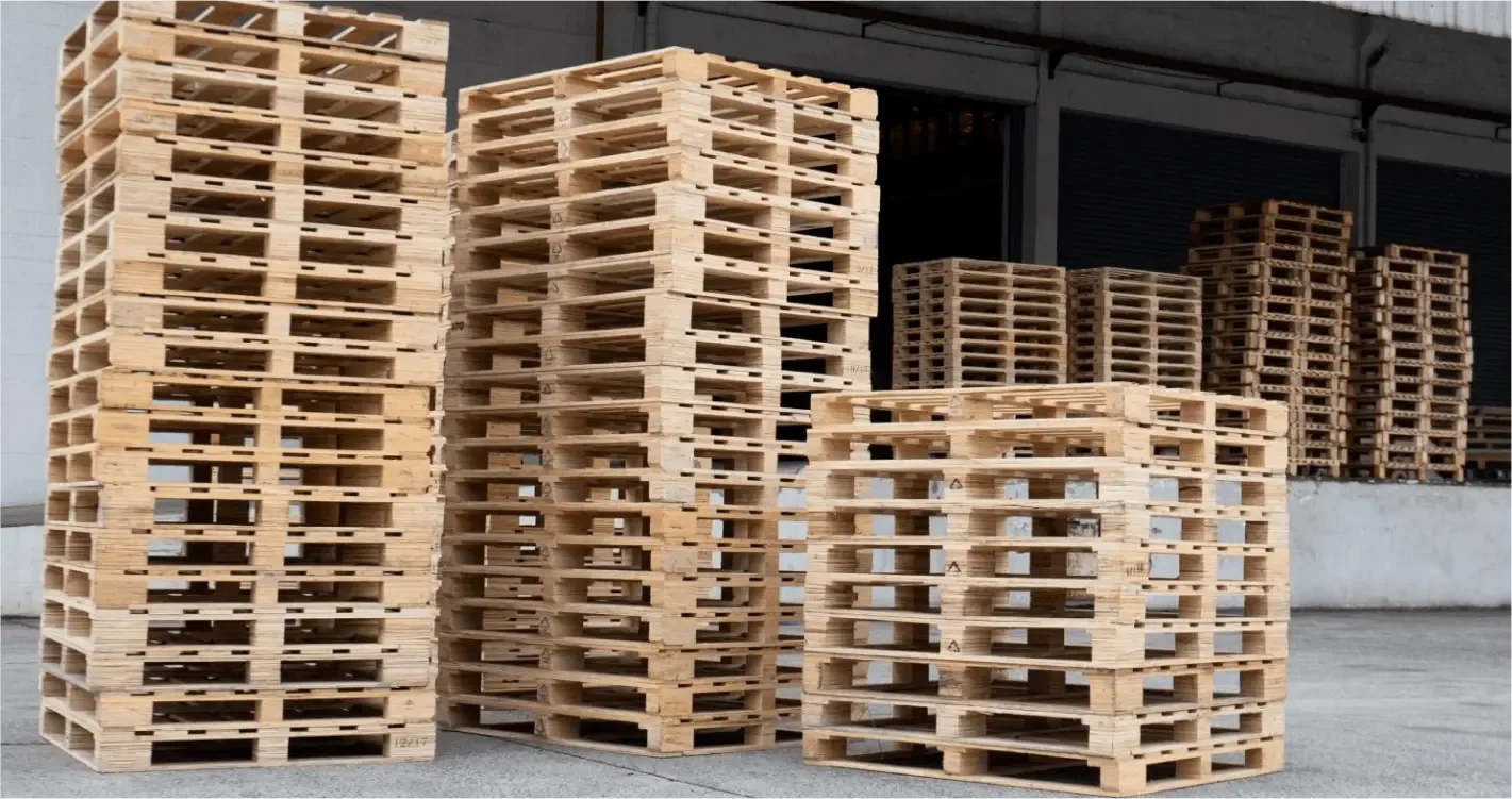 Stacks of graded used pallets at our yard